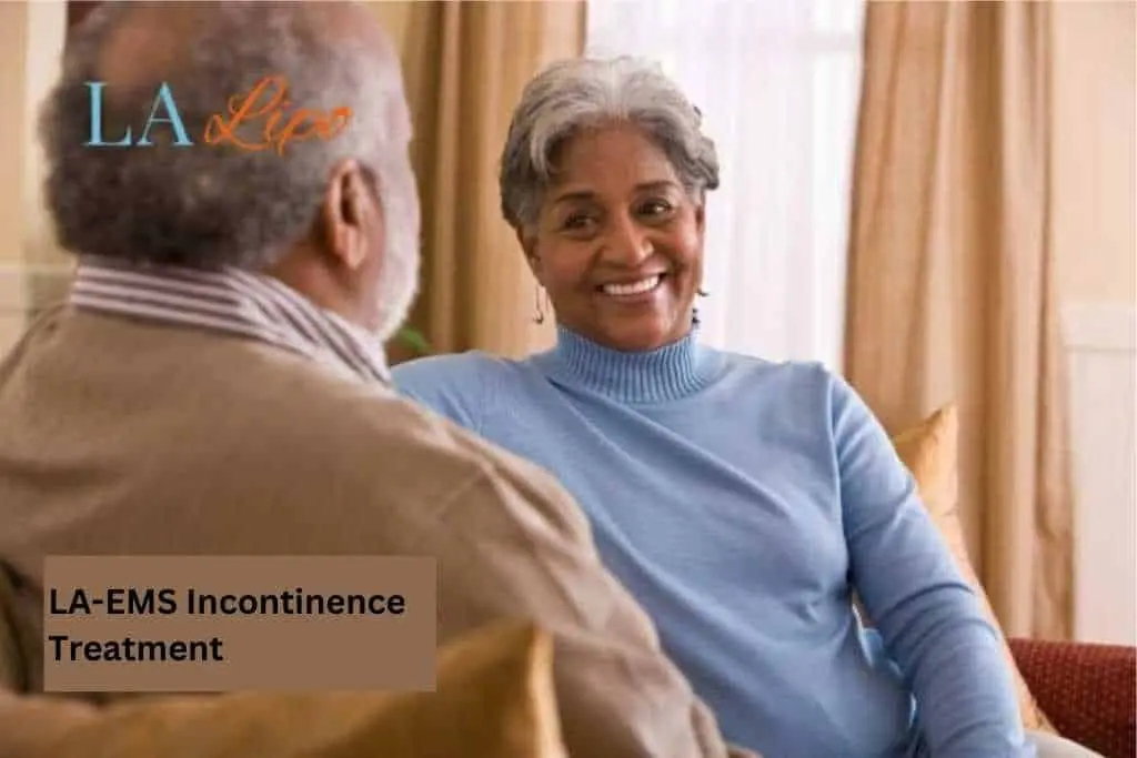 Couple sat smiling at each other - LA-EMS treatment Chorleywood